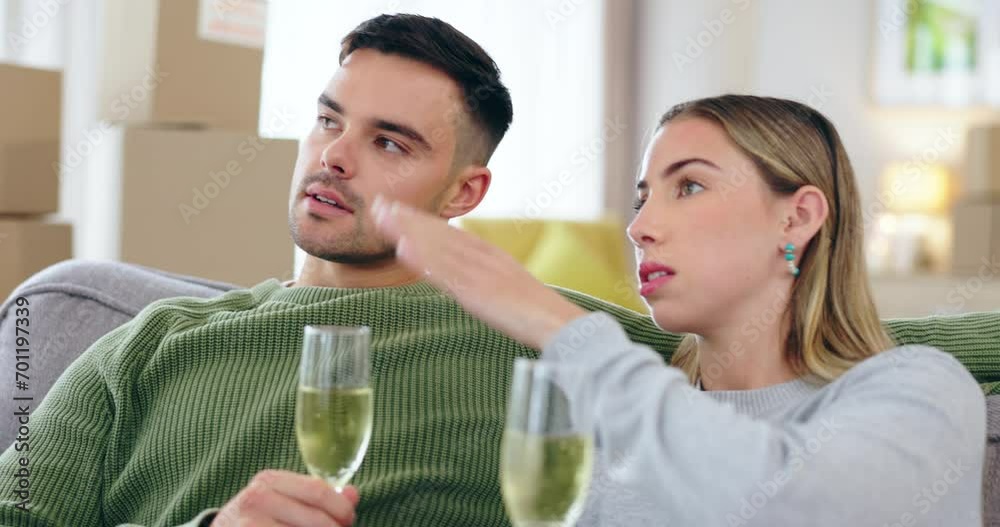 Couple, champagne and together on sofa in new house, property or vision for planning, boxes and chat. Man, woman and drink for celebration, investment and mortgage in living room, ideas or decorating Couple, champagne and together on sofa in new house, property or vision for planning, boxes and chat. Man, woman and drink for celebration, investment and mortgage in living room, ideas or decorating