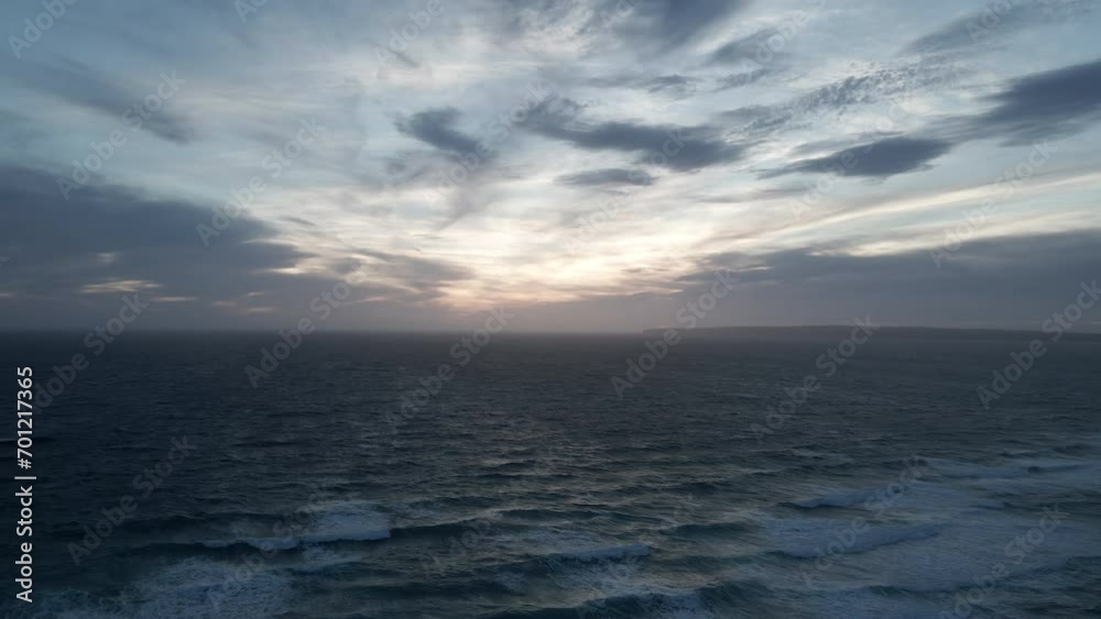 Hypnotic Ocean Waves at Sunset with Distant Land Horizon Hypnotic Ocean Waves at Sunset with Distant Land Horizon