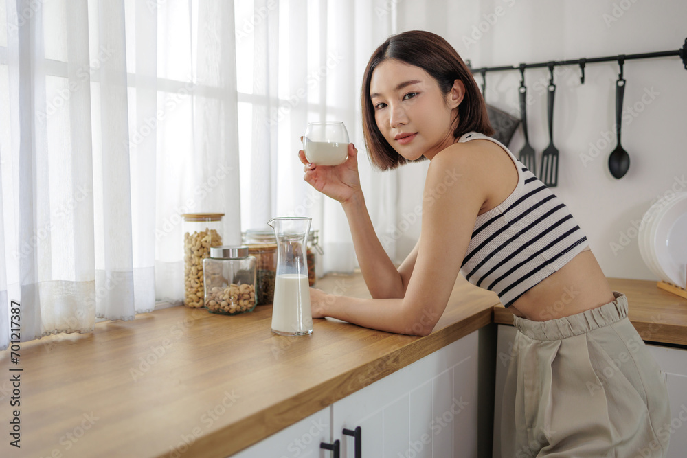 Morning Serenity, Contemplative Woman with a Glass of Milk Morning Serenity, Contemplative Woman with a Glass of Milk