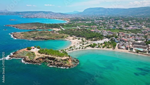 Aerial view of Stavros with turquoise water and sandy beach overlooked by craggy mountains in Crete, Greece. Drone view of Sandy Cove, an excellent spot for relaxing holidays in Greece. photo