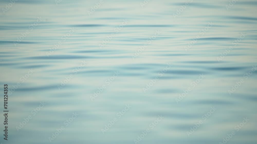 Sea water surface. Camera flies over the calm azure sea. Nobody. Holiday recreation concept. Abstract nautical summer ocean nature. Weather and climate change. Slow motion. Close up