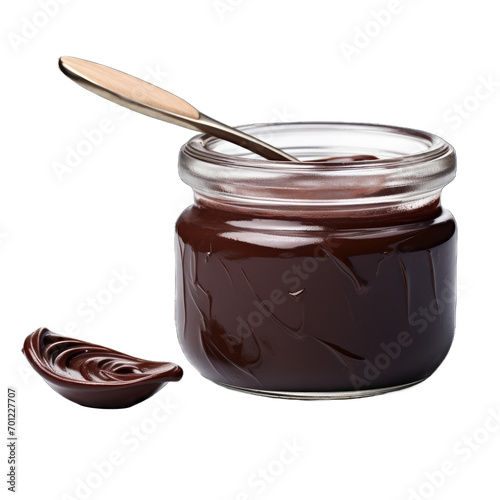 ilver metal spoon is dipped into the chocolate spread creating a swirl pattern on the surface photo