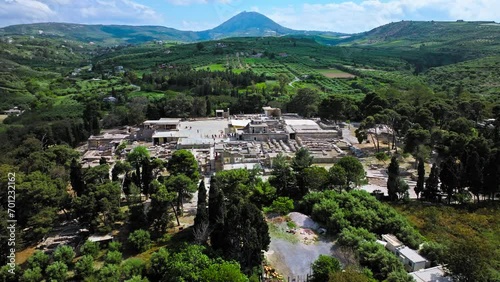 View from above Knossos Palace complex, the largest Bronze Age archaeological site in Crete, Greece. Aerial view of a Romanized royal Knossos, modern port city on the north-central coast of Crete. photo