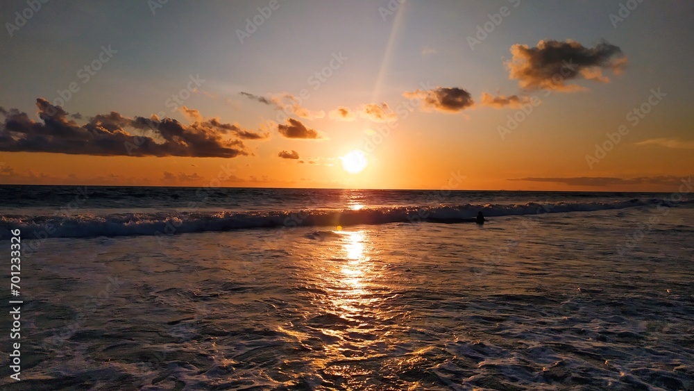 The beautiful and pretty sunset view on Nusa Penida Island with a beautiful orange sky The beautiful and pretty sunset view on Nusa Penida Island with a beautiful orange sky