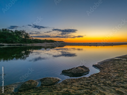 Summer sunrise at the seaside lagoon