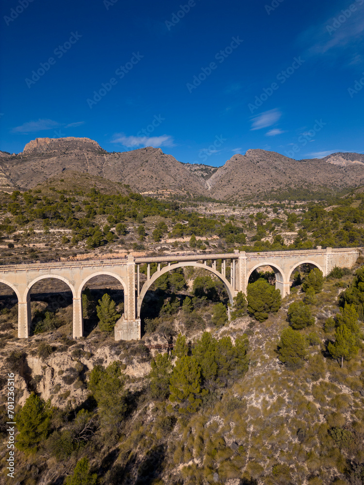 Old bridge on the Maigmó Greenway, a fascinating 22 kilometer route that follows in the footsteps of the old railway route, Alicante, Spain  - stock photo