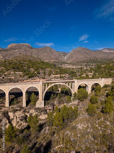 Old bridge on the Maigmó Greenway, a fascinating 22 kilometer route that follows in the footsteps of the old railway route, Alicante, Spain - stock photo