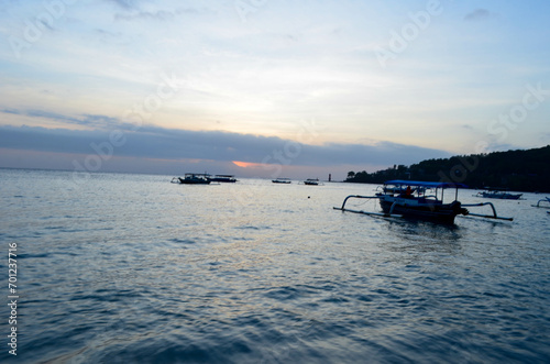 The beauty of Senggigi Beach at sunset with boats that decorate the beautiful beachfront