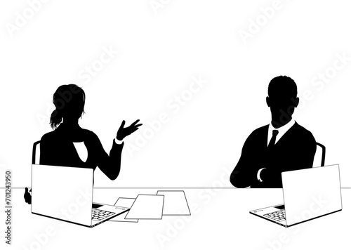 News anchor presenters or business people seated at a desk with laptops in silhouette