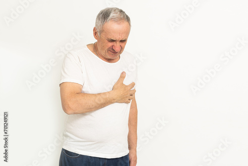 an elderly man has a heartache