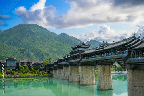 The river, the town, the mountains and the Fengyu Bridge are picturesque. Zhoushui Ancient Town is a historical and cultural attraction. Chongqing, China.