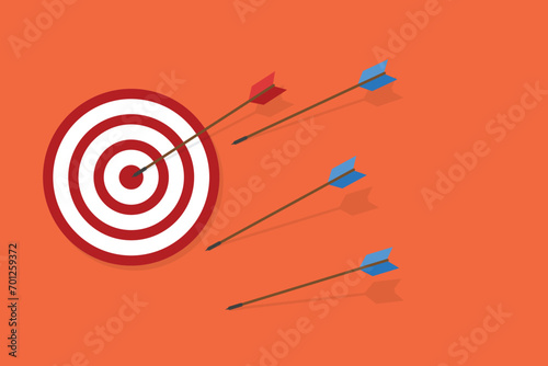 Business challenge failure and success concept. Blue arrows missed hitting target and only red one hits the center. 
