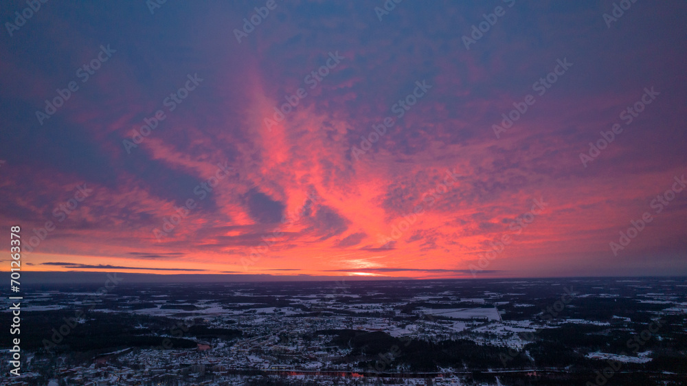 Afterglow over Dramatic Sky at Sunrise. Colorful sky at dawn with a serene and scenic landscape. Cityscape at Sunset with Beautiful Sky and Urban Landscape