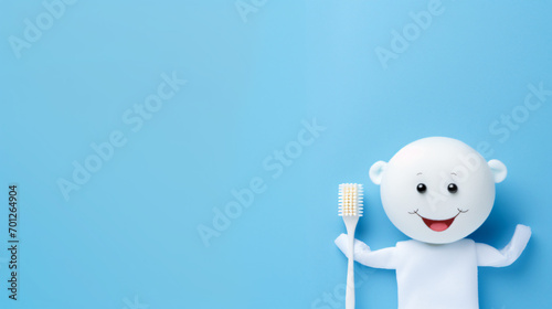 Cute baby lies with a toothbrush on a blue background © Mishab
