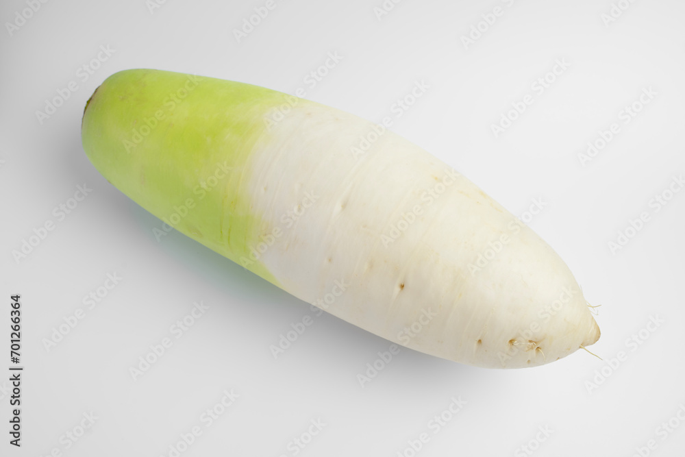 One radish root neatly arranged on a white background One radish root neatly arranged on a white background