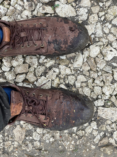 Dirty rain-soaked shoes in Soroca, Moldova photo