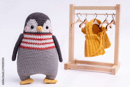 Handmade crochet penguin toy, amigurumi, isolated.