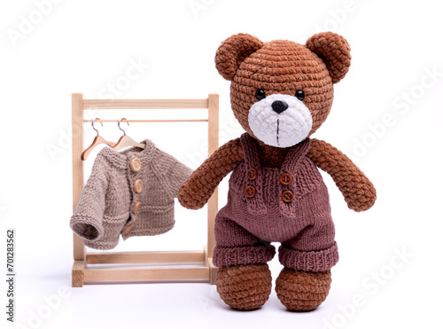 Handmade crocheted bear toy, amigurumi, isolated.