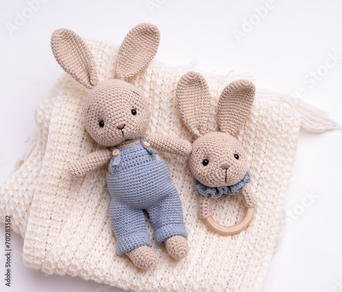 Handmade crocheted bunny toy, amigurumi, isolated.