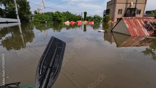 Flooding in Kherson town as a result of the explosion of a dam on the Dnipro river in city of Novaya Kakhovka. Consequences of the detonation of Kakhovka Hydroelectric Power Station. War in Ukraine. photo