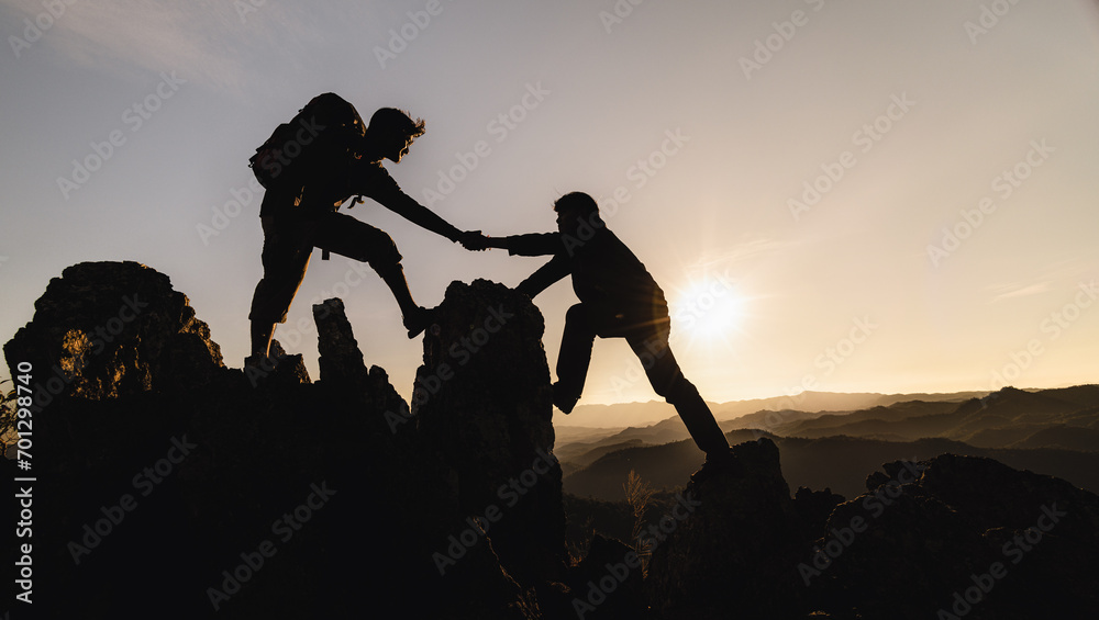 silhouette of Teamwork of three  hiker helping each other on top of mountain climbing team. Teamwork friendship hiking help each other trust assistance silhouette in mountains, sunrise. - obrazy, fototapety, plakaty 