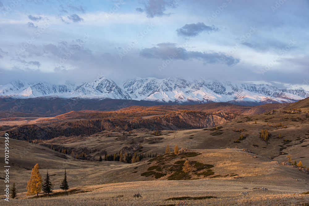 Altai Republic. North Chuysky ridge. Mountains covered with snow during sunrise. Mountain landscape.