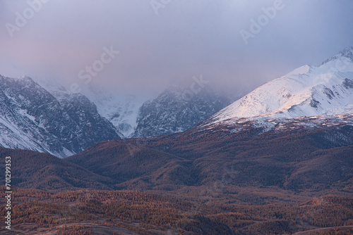 Mountains covered with snow during sunrise. Mountain landscape.