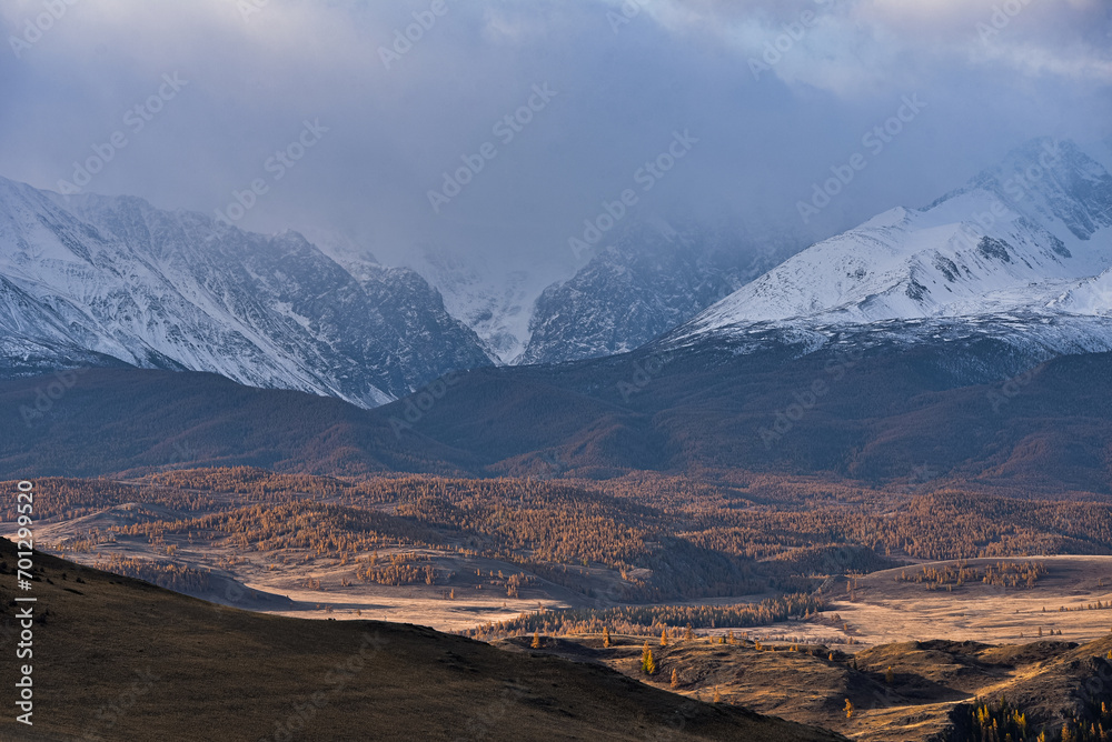 Mountains covered with snow during sunrise. Mountain landscape.
