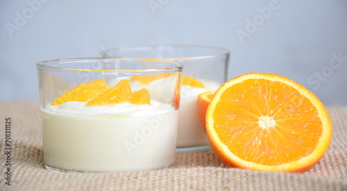 Orange cream, dessert, delicious fruity cream with oranges in a glass, isolated, dessert winter