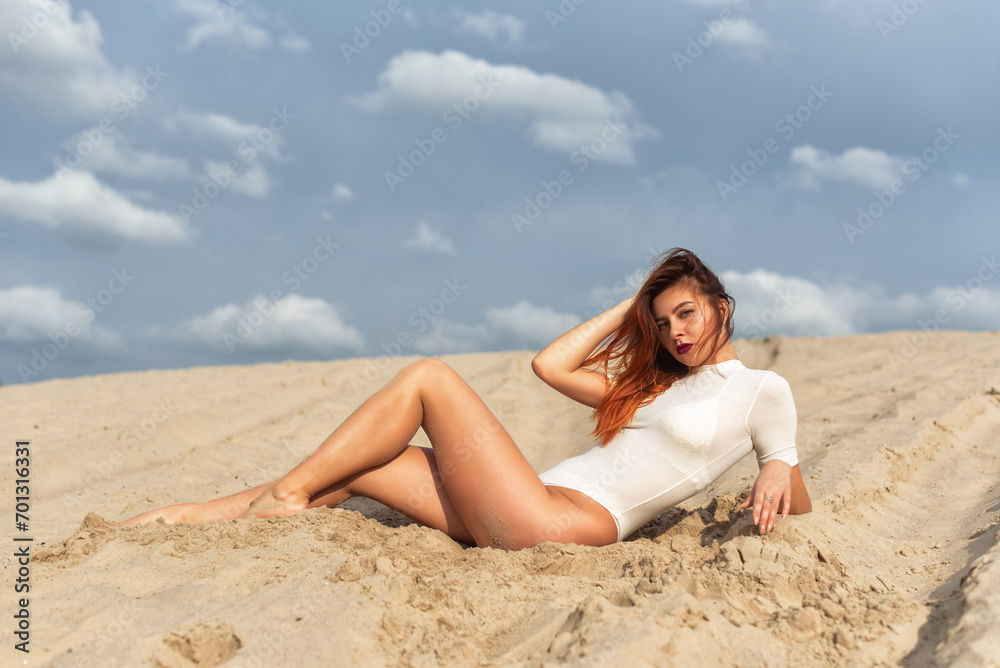 Tall girl on a sand dune