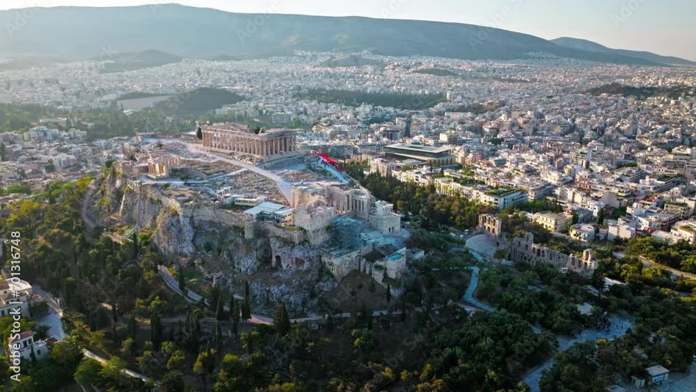 Aerial view of the ancient citadel Acropolis of Athens, historical landmark. Sunset over temple complex on rocky hilltop, landmark temple ruins on archaeological site of Parthenon and Amphitheater. Aerial view of the ancient citadel Acropolis of Athens, historical landmark. Sunset over temple complex on rocky hilltop, landmark temple ruins on archaeological site of Parthenon and Amphitheater.