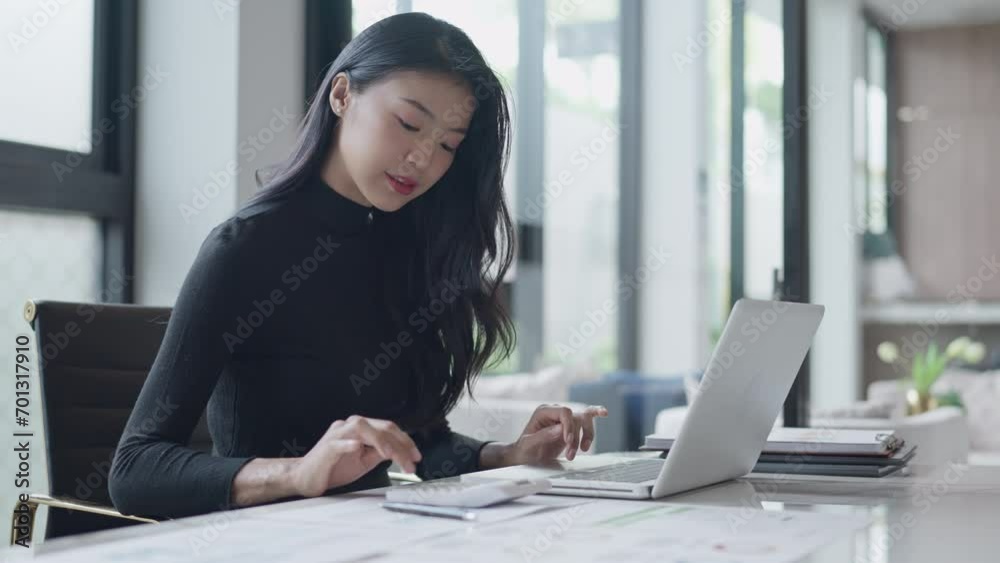Business woman analyzing data paperwork calculating numbers Business woman analyzing data paperwork calculating numbers
