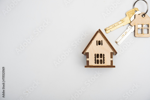House with keychain on white background. Real estate and property concept.