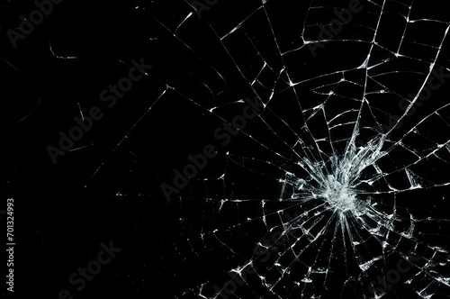 Photo of broken glass on a black background, cracks.