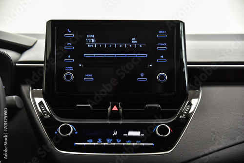 Car multimedia system with buttons.