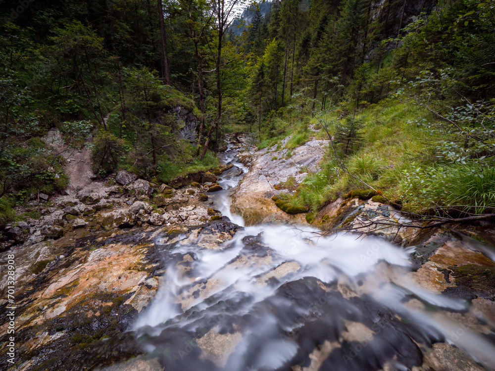 Berchtesgaden Weissach water fall long exposure embedded in green nature
