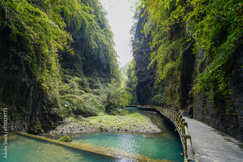 Lush green plants and turquoise river water. A great place to travel in summer. The Ayi Valley is deep, the river bed is narrow, and the water is crystal clear. photo