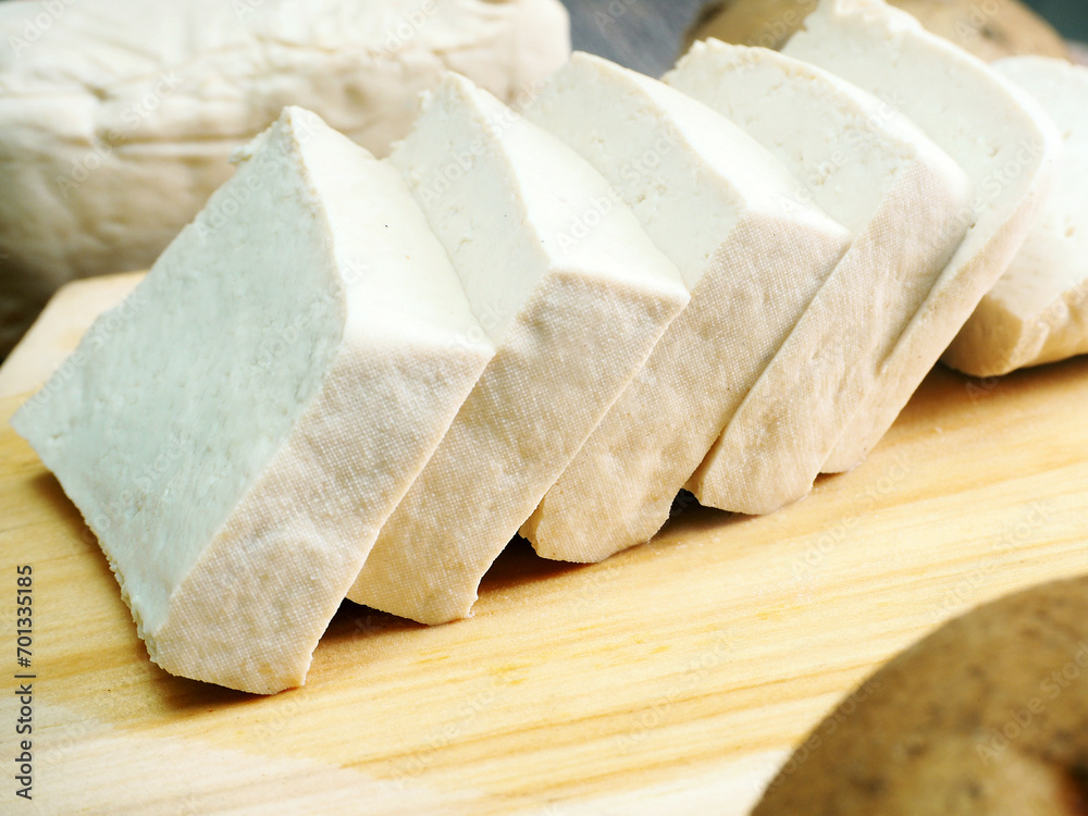 white raw tofu, create from soy bean, this healthy food countain protein.