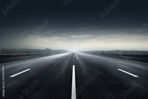 Empty asphalt road in the cloudy sky. Concept of speed and travel