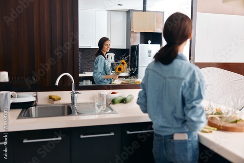 Happy Caucasian Woman Cleaning the Kitchen Sink, Enjoying Healthy Food Preparation Indoors
