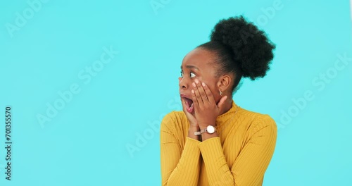 Wow, mockup and face of a black woman on a blue background for a retail deal or promotion. Surprise, portrait and an African girl or model with shock about an announcement with space on a backdrop photo