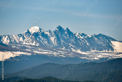 snowy peaks of mountains on a sunny day.
