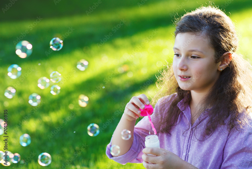 Little cute girl blowing soap bubbles outdoors Little cute girl blowing soap bubbles outdoors