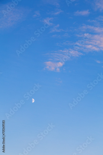 Mezza Luna nel cielo azzurro photo