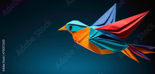 A perfectly crafted origami bird in vibrant hues against a deep teal background.