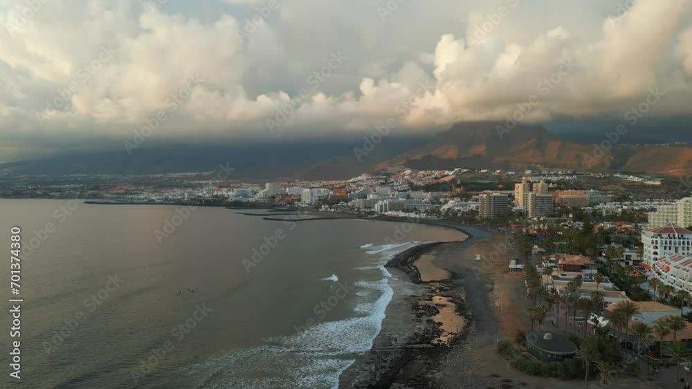 sunset at ocean shore with hotels and villas of Tenerife, Canary island, aerial