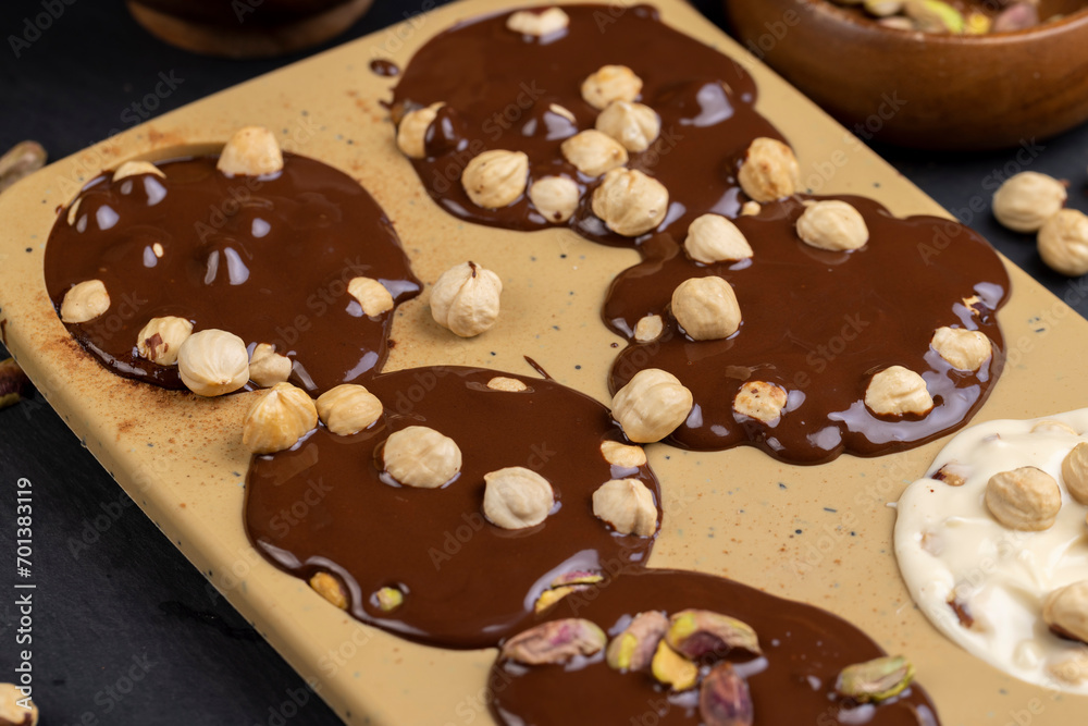 making homemade chocolate with different ingredients making homemade chocolate with different ingredients