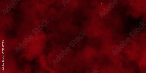 Red powder explosion cloud on black background. Freeze motion of red color dust particles splashing.Colorful red textures for making flyers, posters and cover.