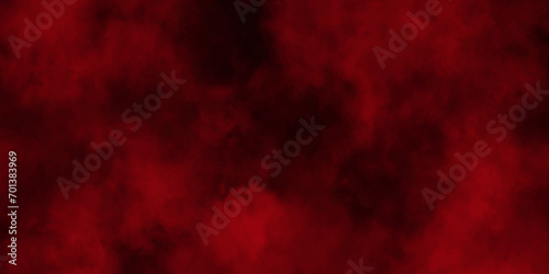 Red powder explosion cloud on black background. Freeze motion of red color dust particles splashing.Colorful red textures for making flyers, posters and cover.