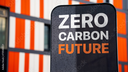 Zero carbon future on a sign in a city business district photo